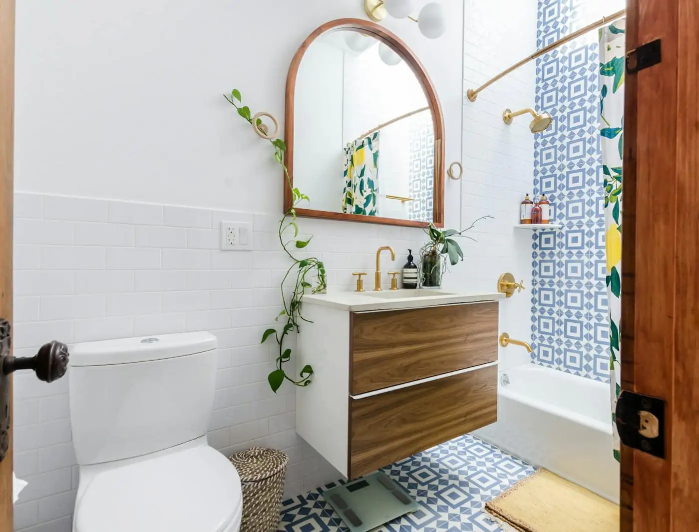 Bathroom with patterned floor tiles and a rain shower