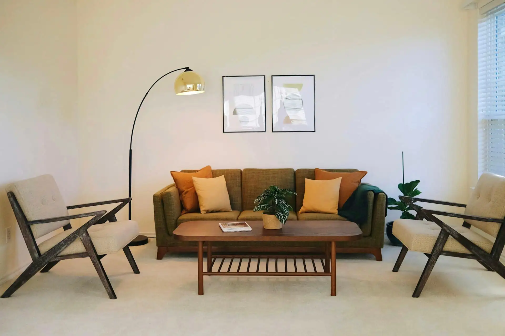 Restored living room with mid-century furniture and warm lighting