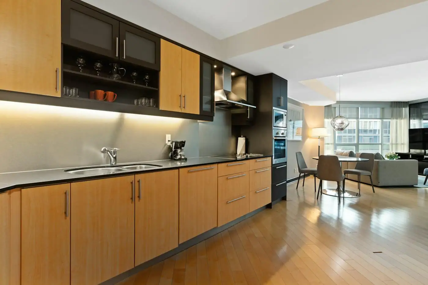 New kitchen with timber cabinets and terrazzo-look worktops